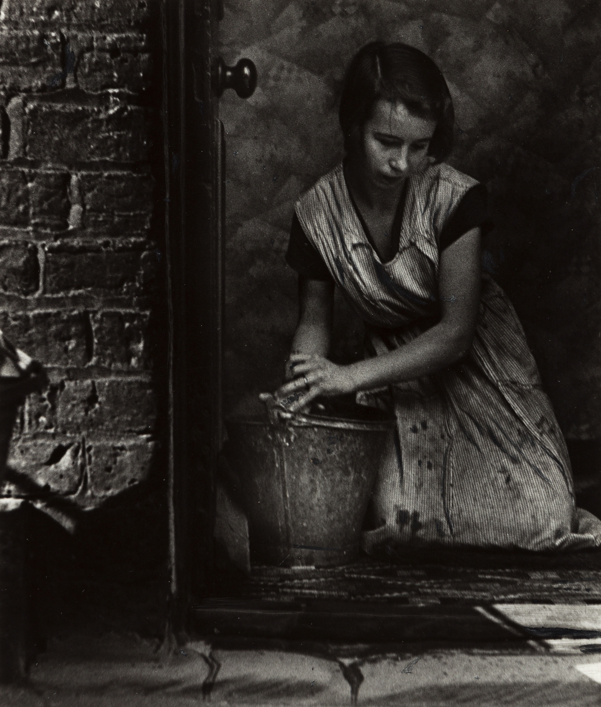 BILL BRANDT (1904-1983) Young housewife, Bethnal Green, London.